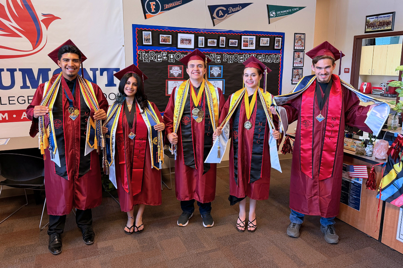 Five Beaumont students in graduation gowns display college honors and awards.