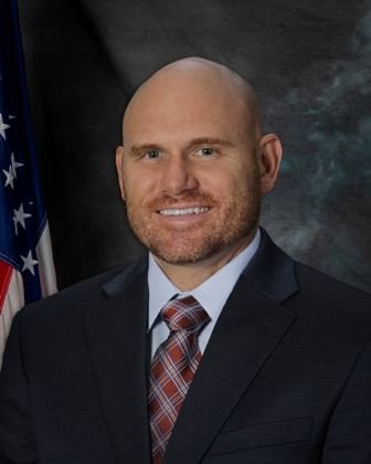 Official portrait of John Manly